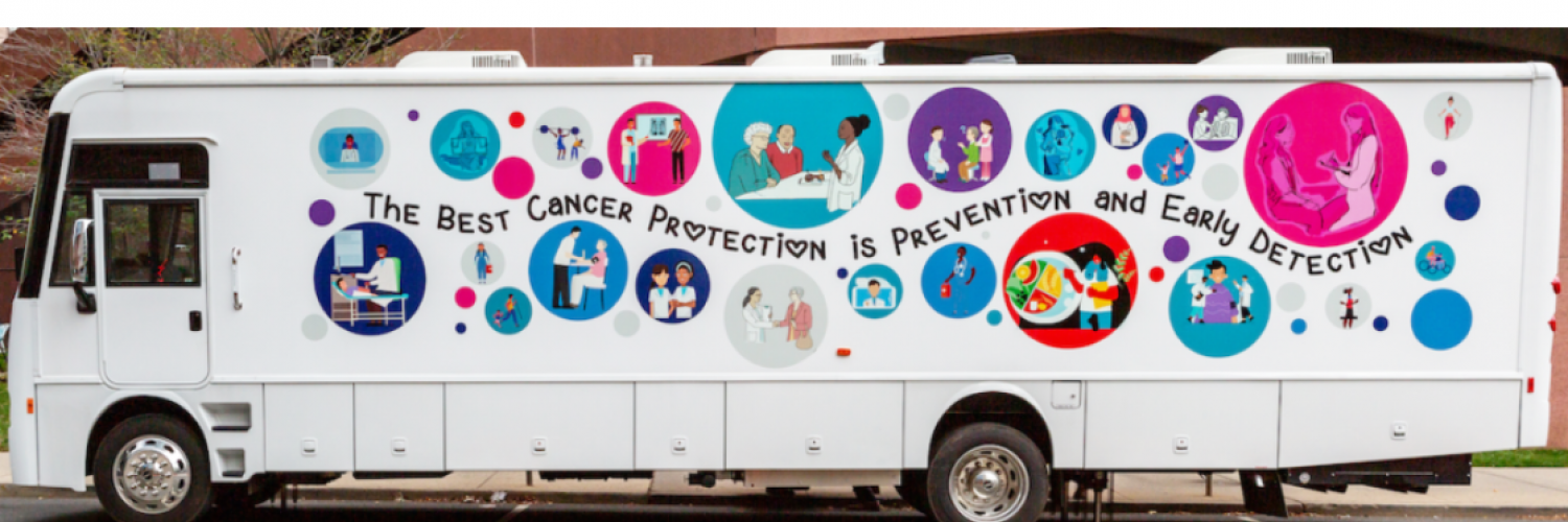 Picture of Screen NJ's "LifeSaver" Mobile Health Unit bus' side-long banner which reads, 'The best cancer protection is prevention and early detection'.